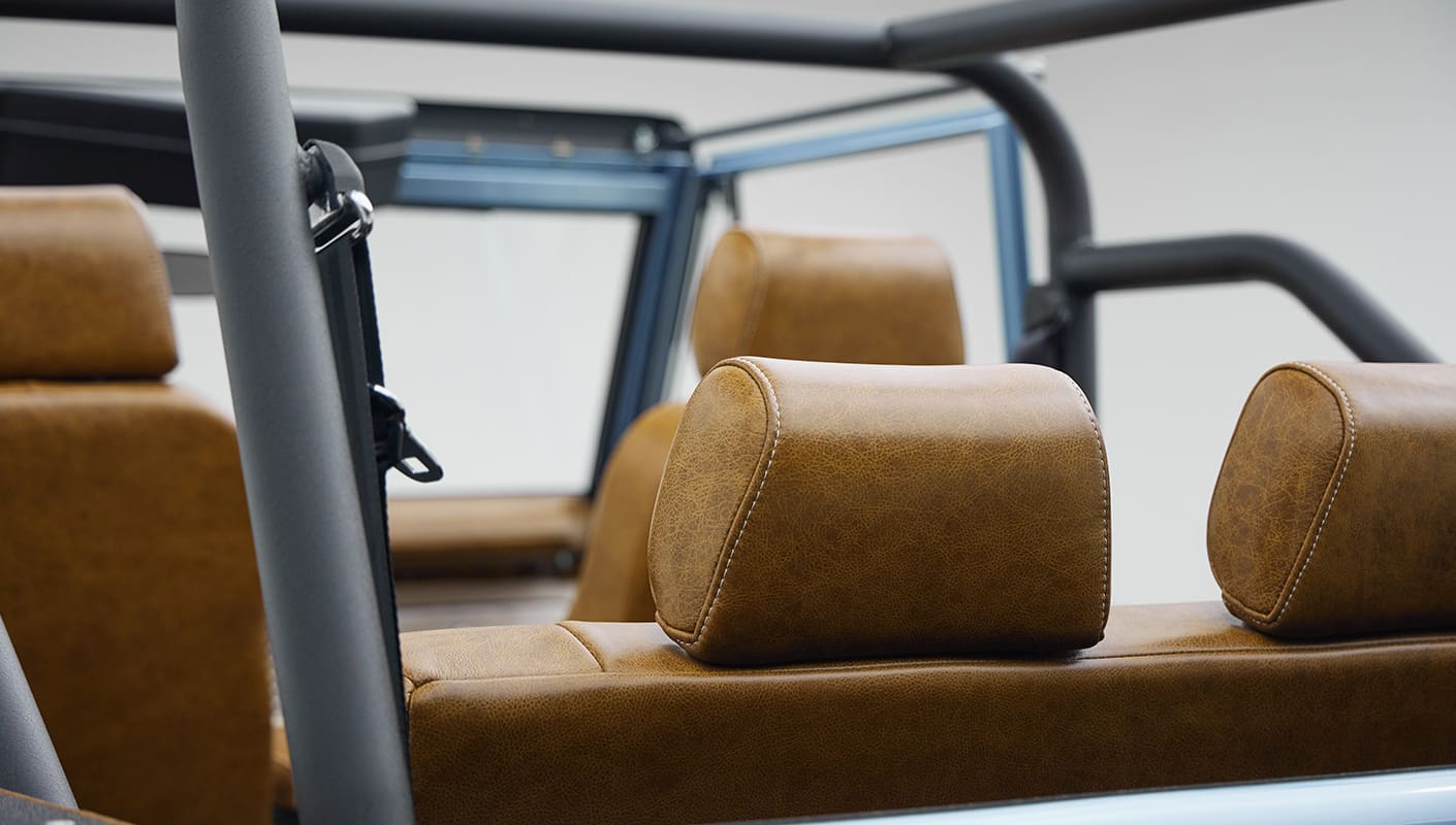 1973 Ford Bronco in Brittany Blue over Whiskey leather headrests