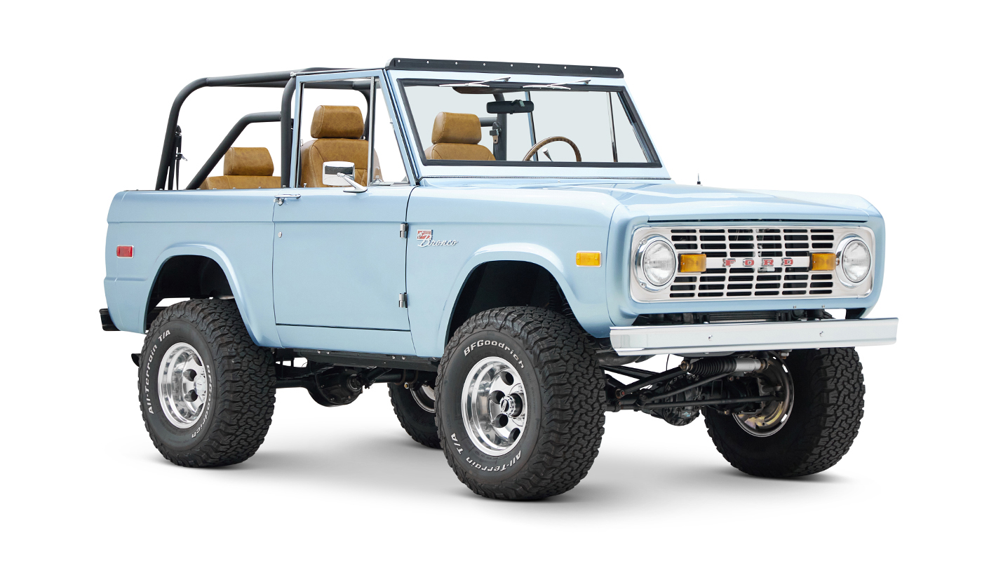 1973 Ford Bronco in Brittany Blue over Whiskey leather passenger front angle