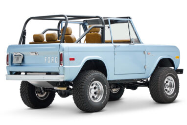 1973 Ford Bronco in Brittany Blue over Whiskey leather passenger rear angle