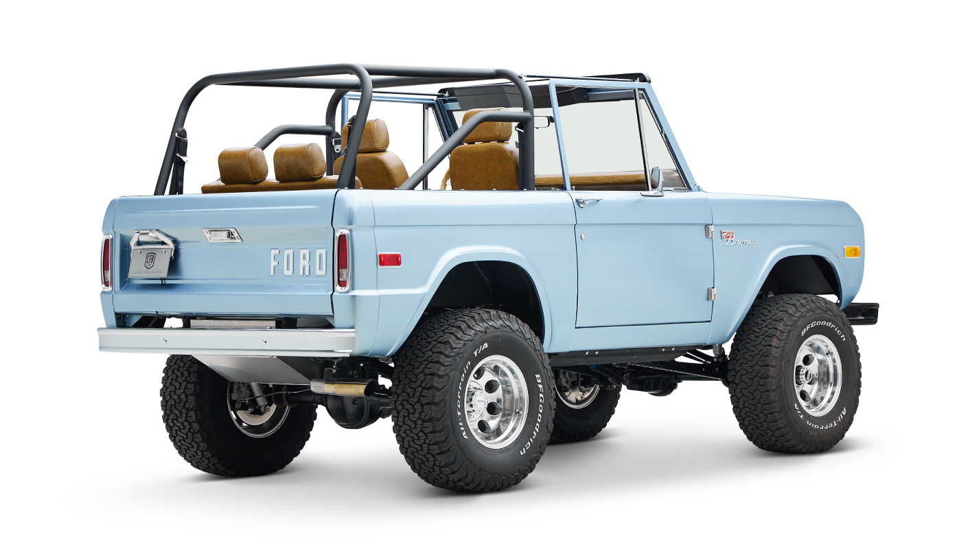 1973 Ford Bronco in Brittany Blue over Whiskey leather passenger rear angle