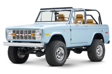 1973 Ford Bronco in Brittany Blue over Whiskey leather driver front angle