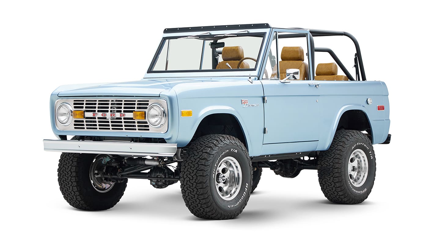 1973 Ford Bronco in Brittany Blue over Whiskey leather driver front angle