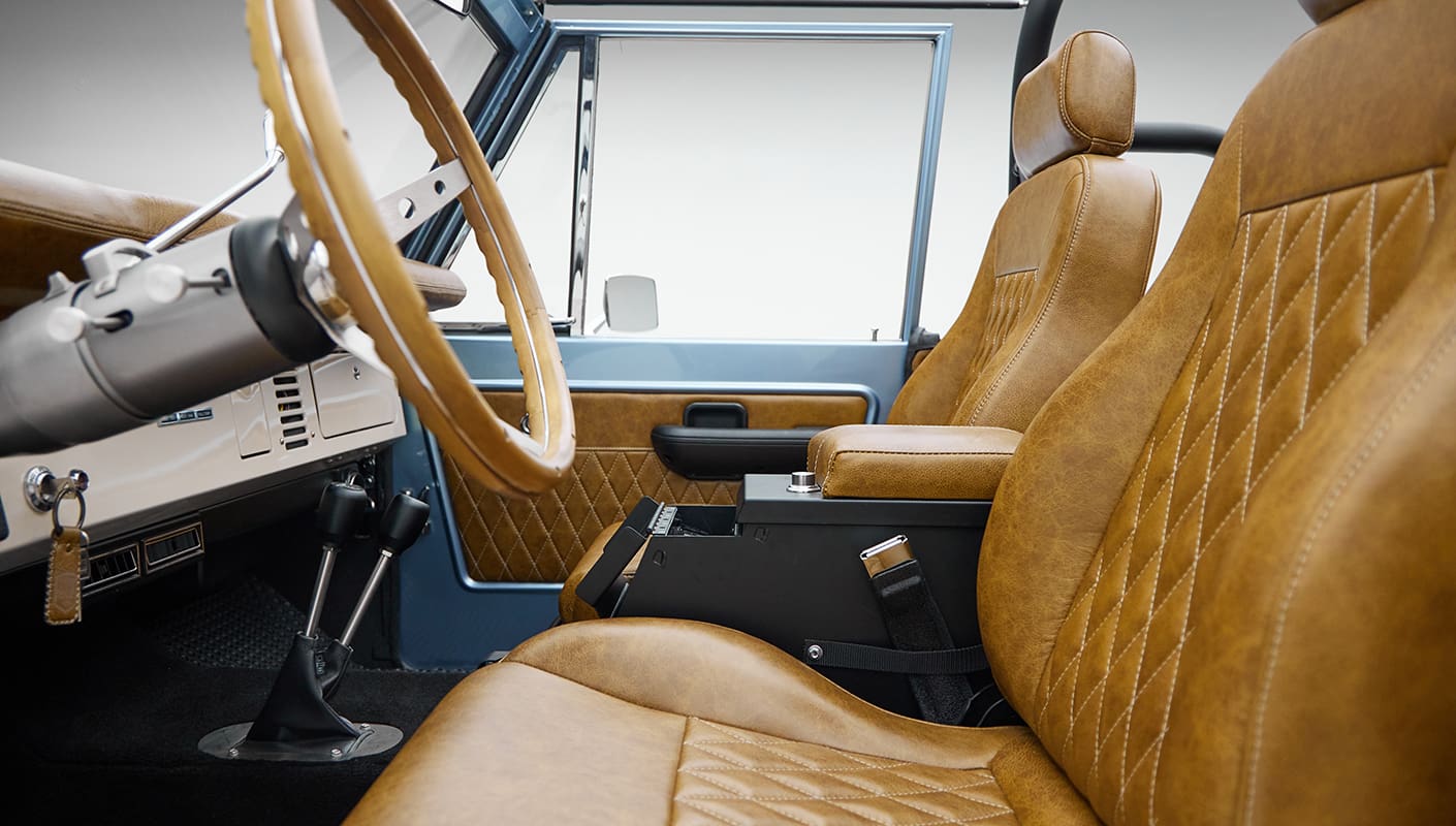 1973 Ford Bronco in Brittany Blue over Whiskey leather driver interior detail
