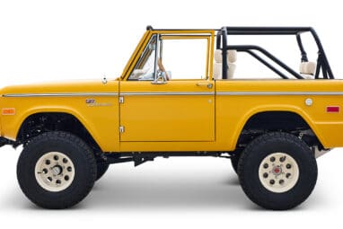 Ford Bronco 1975 in Chrome Yellow with custom Basket Weave Interior and Wimbledon White Wheels