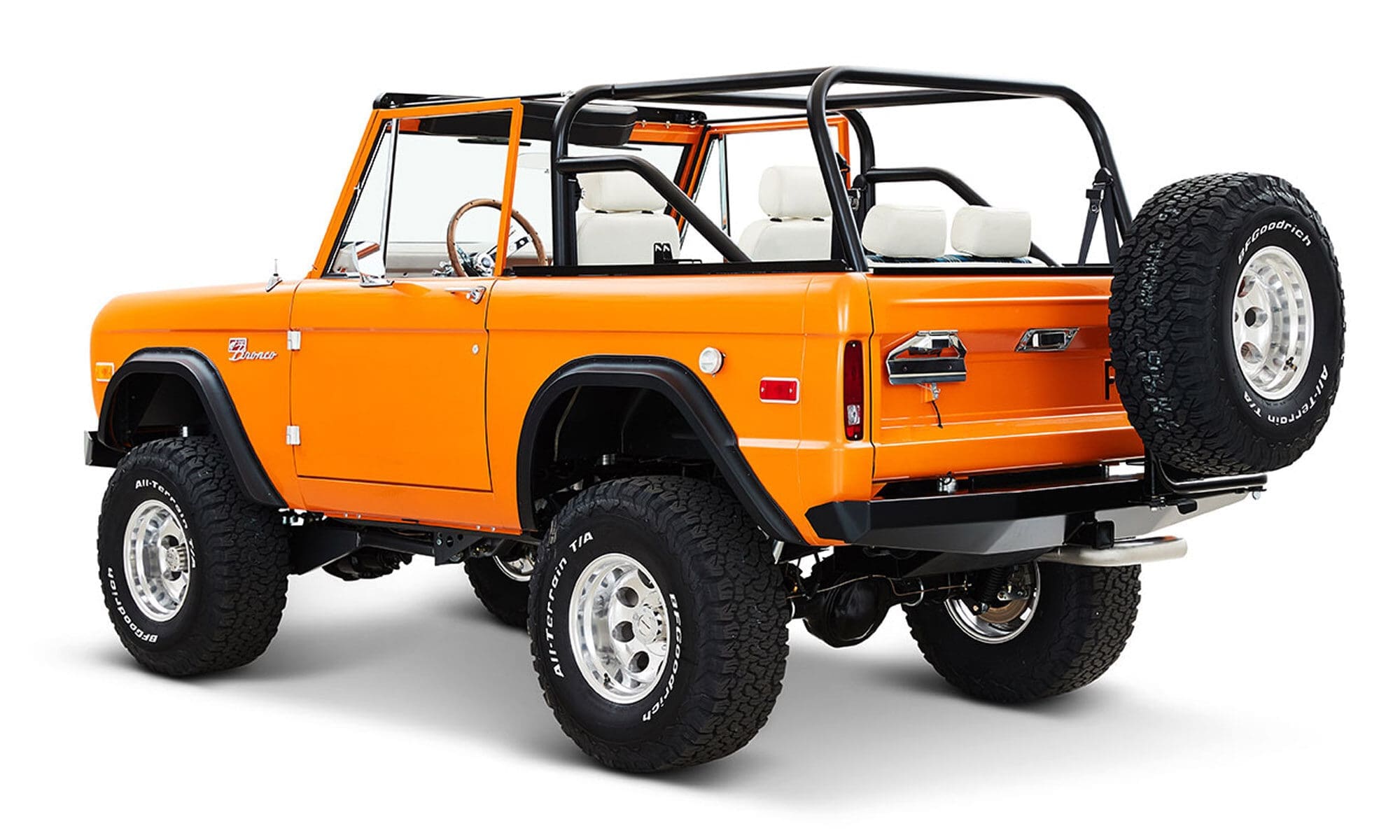 1970 Orange Classic Ford Broncos Coyote Series with white and plaid custom interior and family roll cage