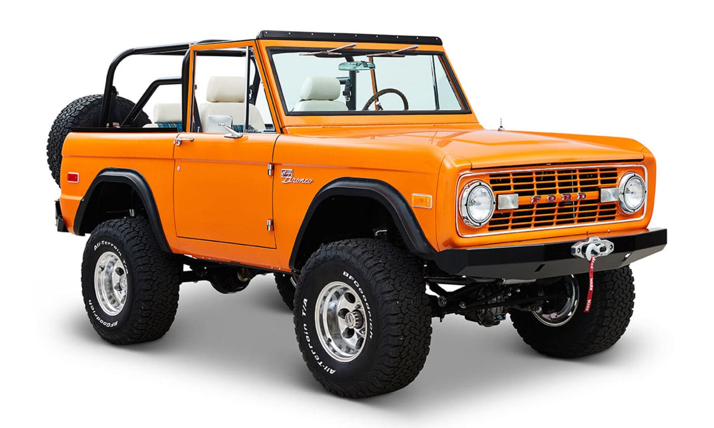 1970 Orange Classic Ford Broncos Coyote Series with white and plaid custom interior and family roll cage