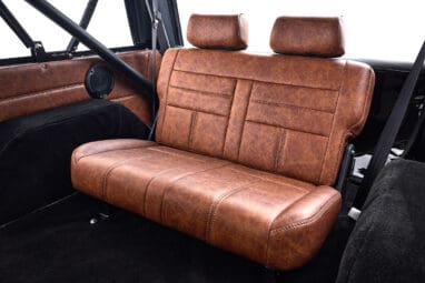 Ford Bronco 1977 302 Series in Adventurine Green with Black Soft Top and Custom Stitch Cigar Leather Interior