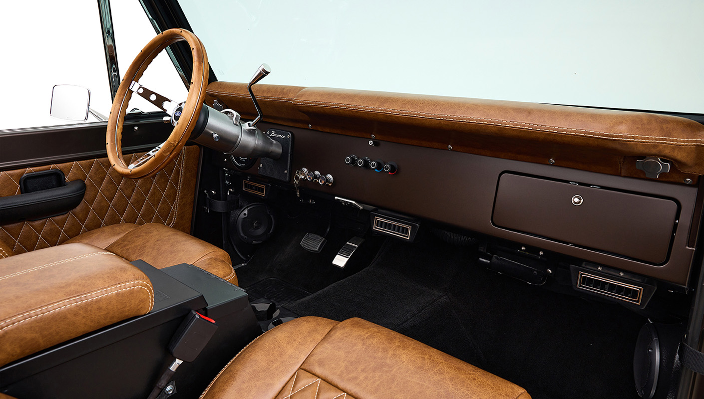 Ford Bronco 1970 in Matte Macadamia Brown with whiskey leather interior and black wheels classic dash