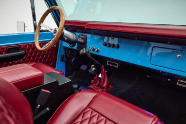 1969 Blue Classic Ford Broncos Coyote Series with Burgundy custom interior, manual transmission and a family roll cage