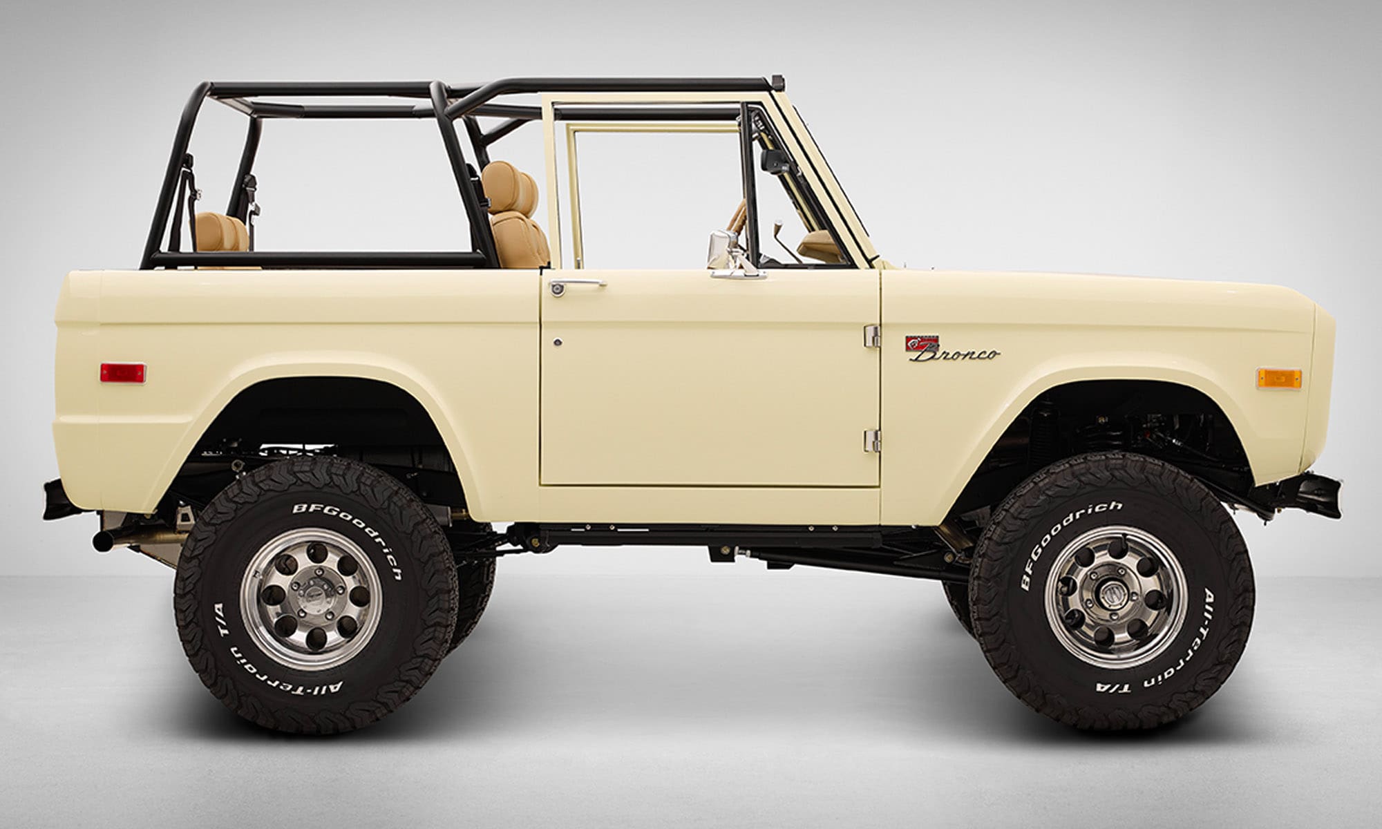 1966 Yellow Classic Ford Bronco Coyote Series with Straw custom interior and family roll cage