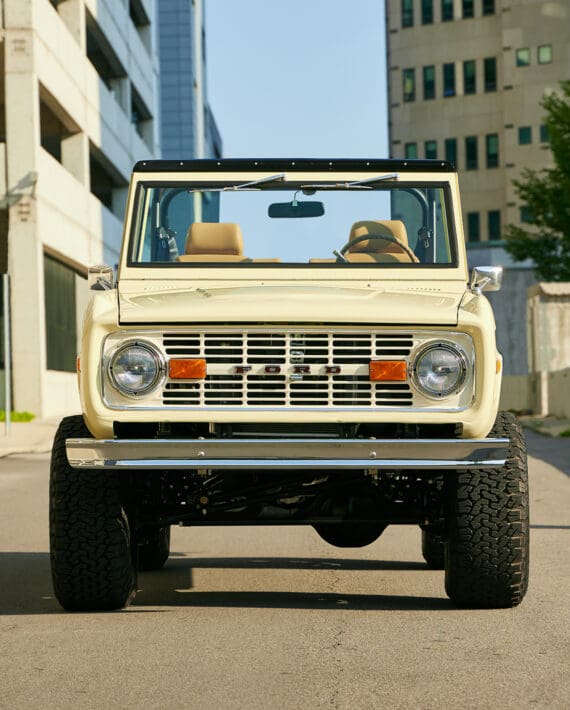 1966 Yellow Classic Ford Bronco Coyote Series with Straw custom interior and family roll cage