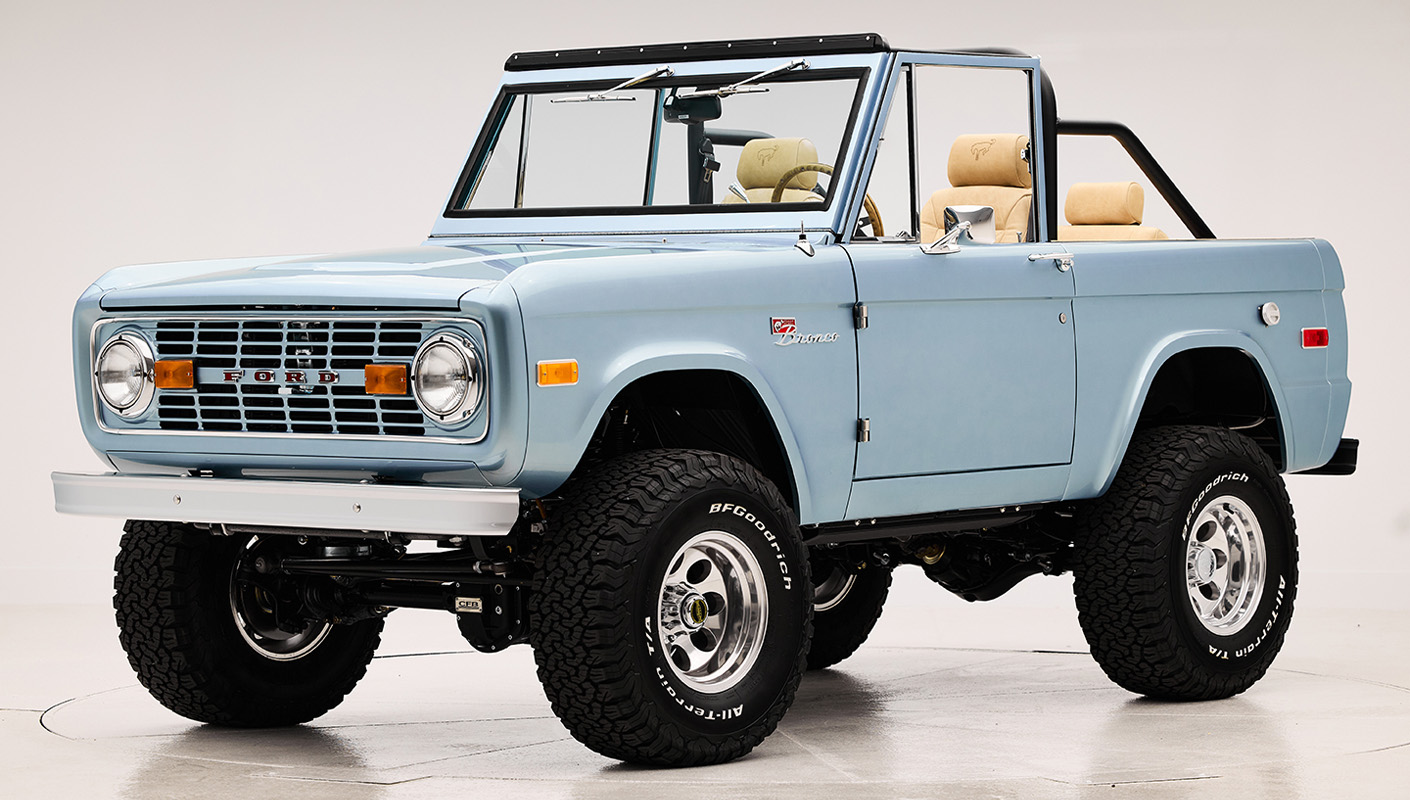 1966 Brittany Blue Classic Ford Bronco with custom diamond stitch interior and factory roll cage
