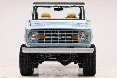 1966 Brittany Blue Classic Ford Bronco with custom diamond stitch interior and color matched grill