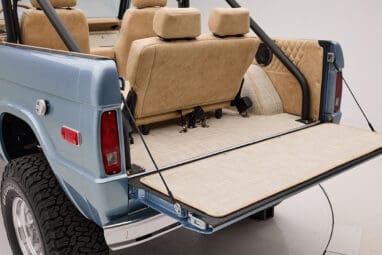 1966 Brittany Blue Classic Ford Bronco with custom diamond stitch interior and custom boat flooring