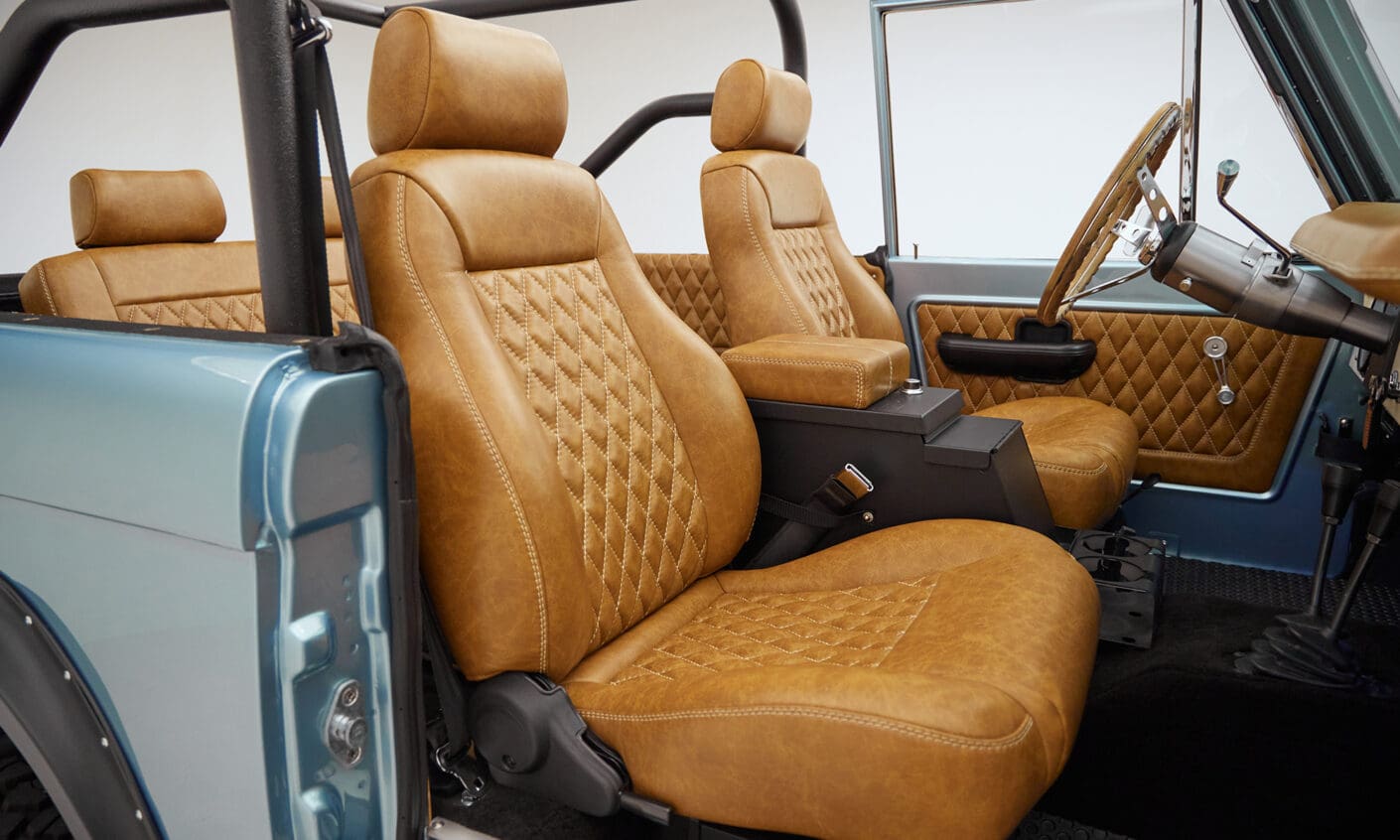 1976 Ford Bronco in Brittany Blue with whiskey diamond stitch passenger seat