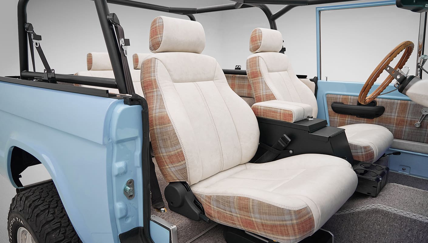 A 1970 Classic Ford Broncos coyote series in frozen blue over custom white rock leather with tartan plaid interior and family cage 2
