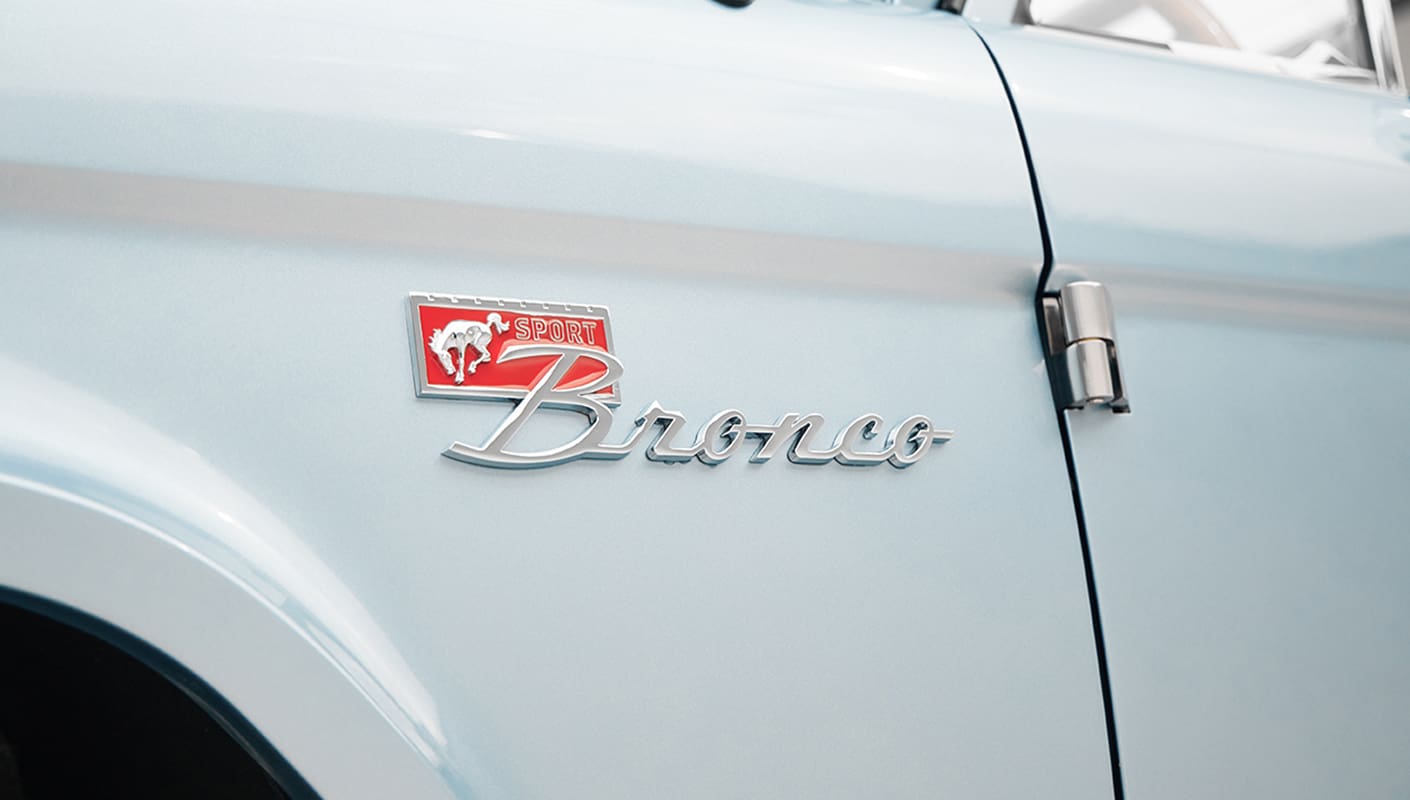 1975 ford bronco painted brittany blue with cowboy debossed, baseball stitch leather emblem