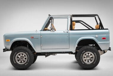1975 ford bronco painted brittany blue with cowboy debossed, baseball stitch leather driver profile