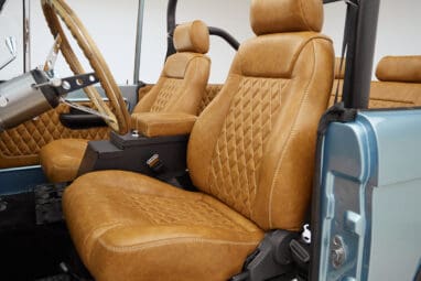 1976 Ford Bronco in Brittany Blue with whiskey diamond stitch leather