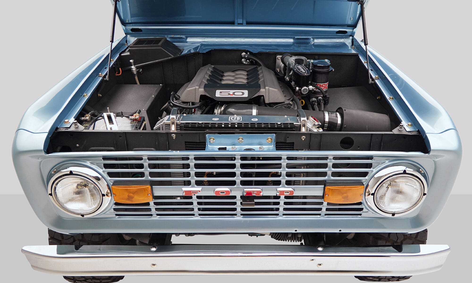 1976 Ford Bronco in Brittany Blue with ford racing coyote 3rd gen motor