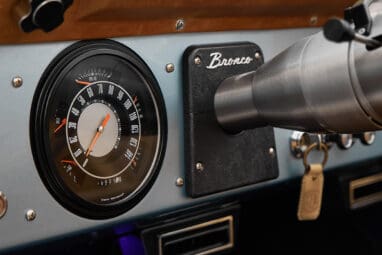 1975 ford bronco painted brittany blue with cowboy debossed, baseball stitch leather gauge
