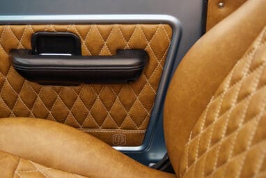 1976 Ford Bronco in Brittany Blue with whiskey diamond stitch leather details