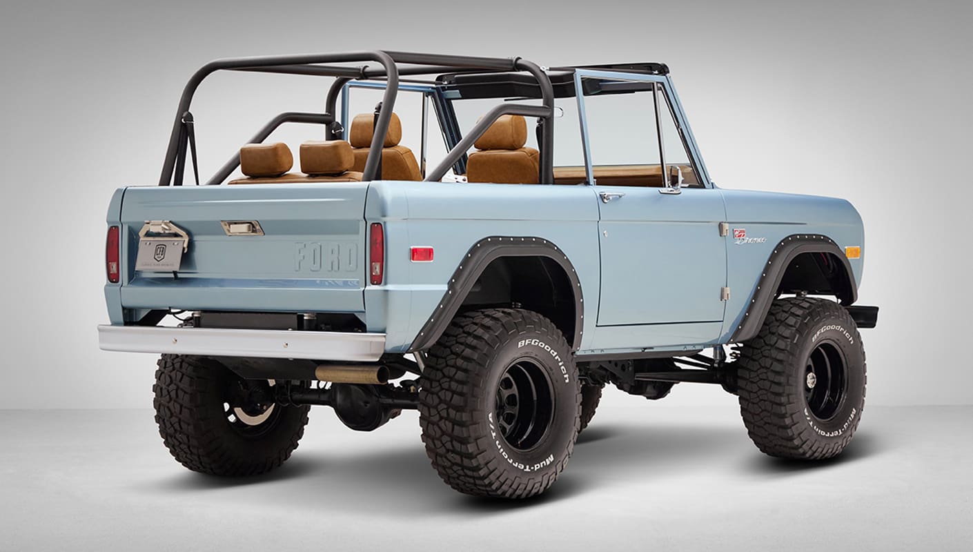 1976 Ford Bronco in Brittany Blue with whiskey diamond stitch passenger rear angle