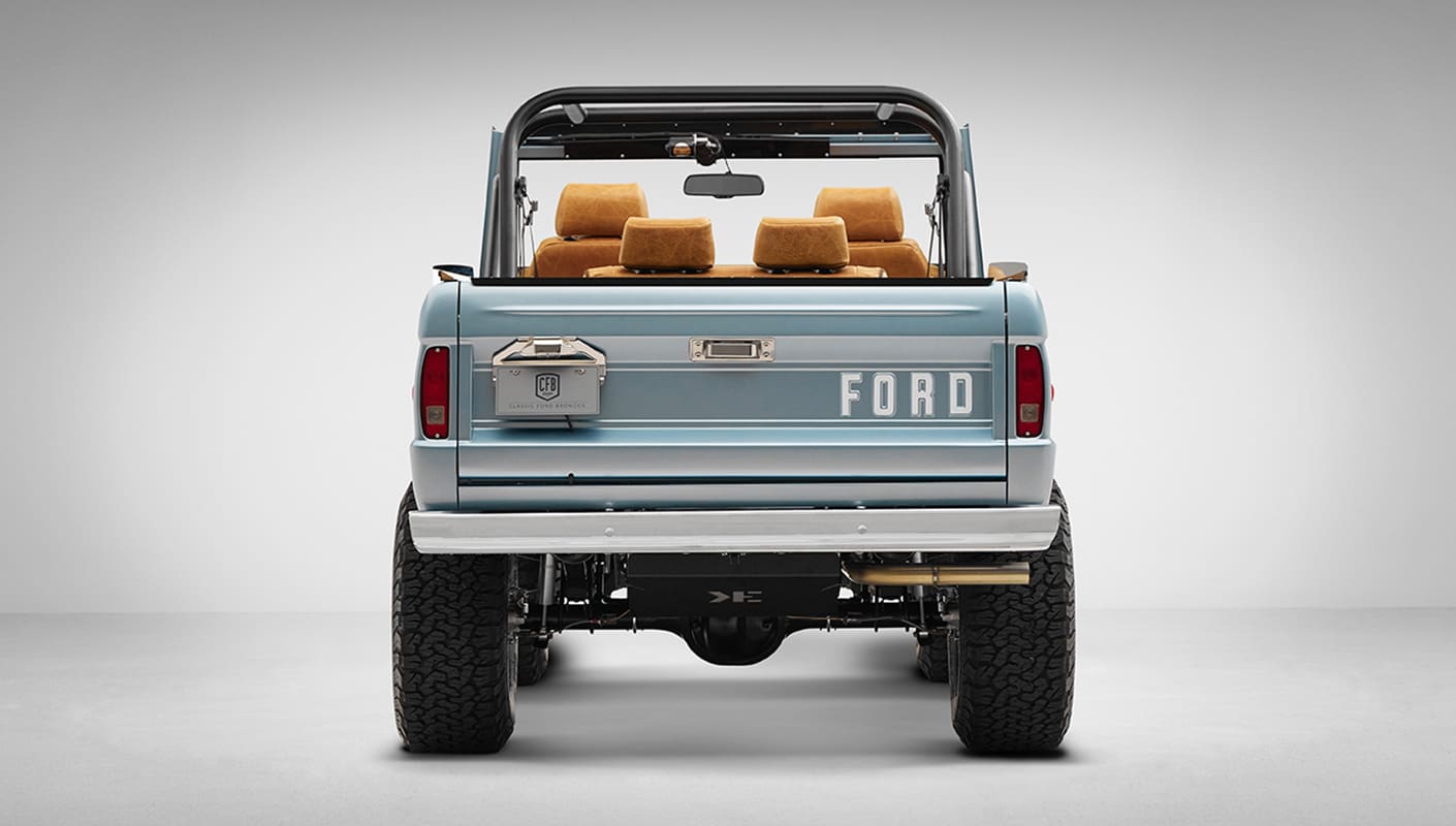 1975 ford bronco painted brittany blue with cowboy debossed, baseball stitch leather rear profile