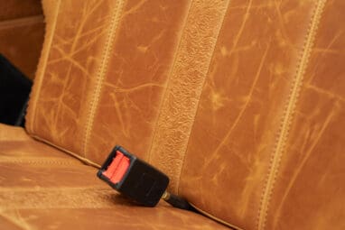 1975 ford bronco painted brittany blue with cowboy debossed, baseball stitch leather passenger seat