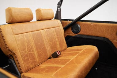 1975 ford bronco painted brittany blue with cowboy debossed, baseball stitch leather rear seat