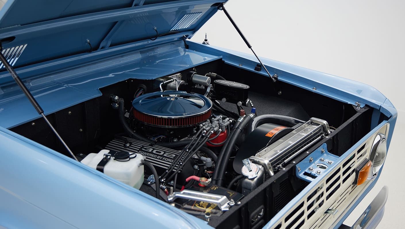1967 Classic Ford Bronco painted in Frozen Blue over Ball Glove leather interior crate 302 angle