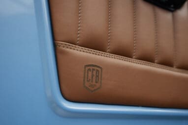 1967 Classic Ford Bronco painted in Frozen Blue over Ball Glove leather interior leather detail