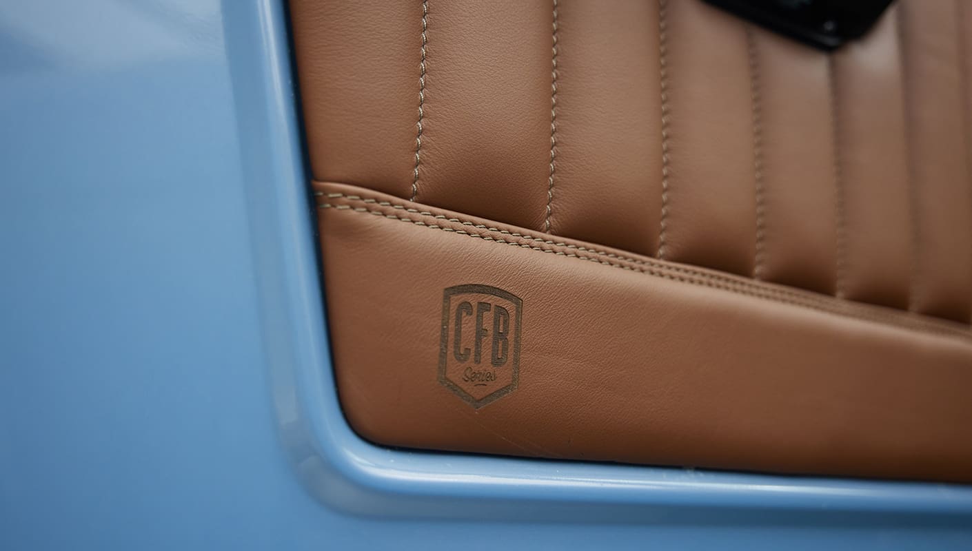 1967 Classic Ford Bronco painted in Frozen Blue over Ball Glove leather interior leather detail