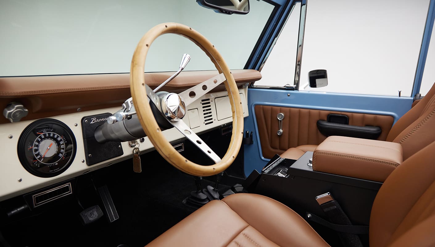 1967 Classic Ford Bronco painted in Frozen Blue over Ball Glove leather interior driver dash