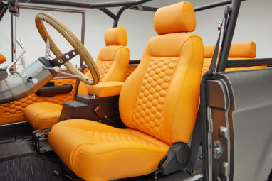 1972 classic ford bronco in matte silver with orange leather interior driver seat