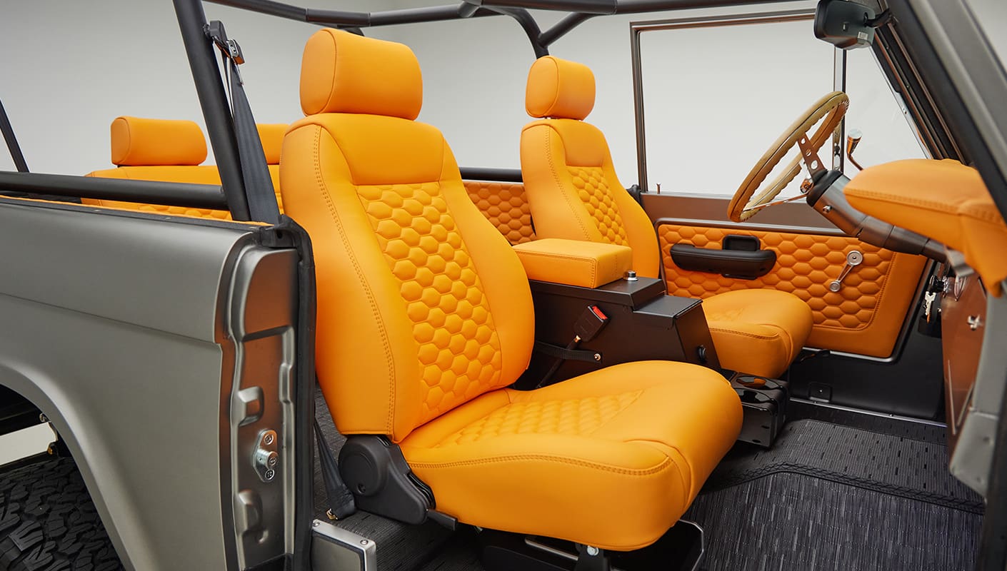 1972 classic ford bronco in matte silver with orange leather interior passenger seat