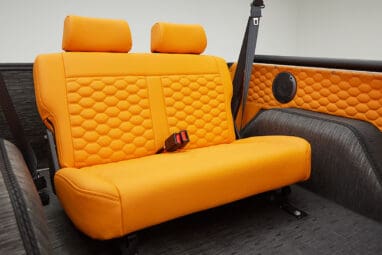 1972 classic ford bronco in matte silver with orange leather interior backseat