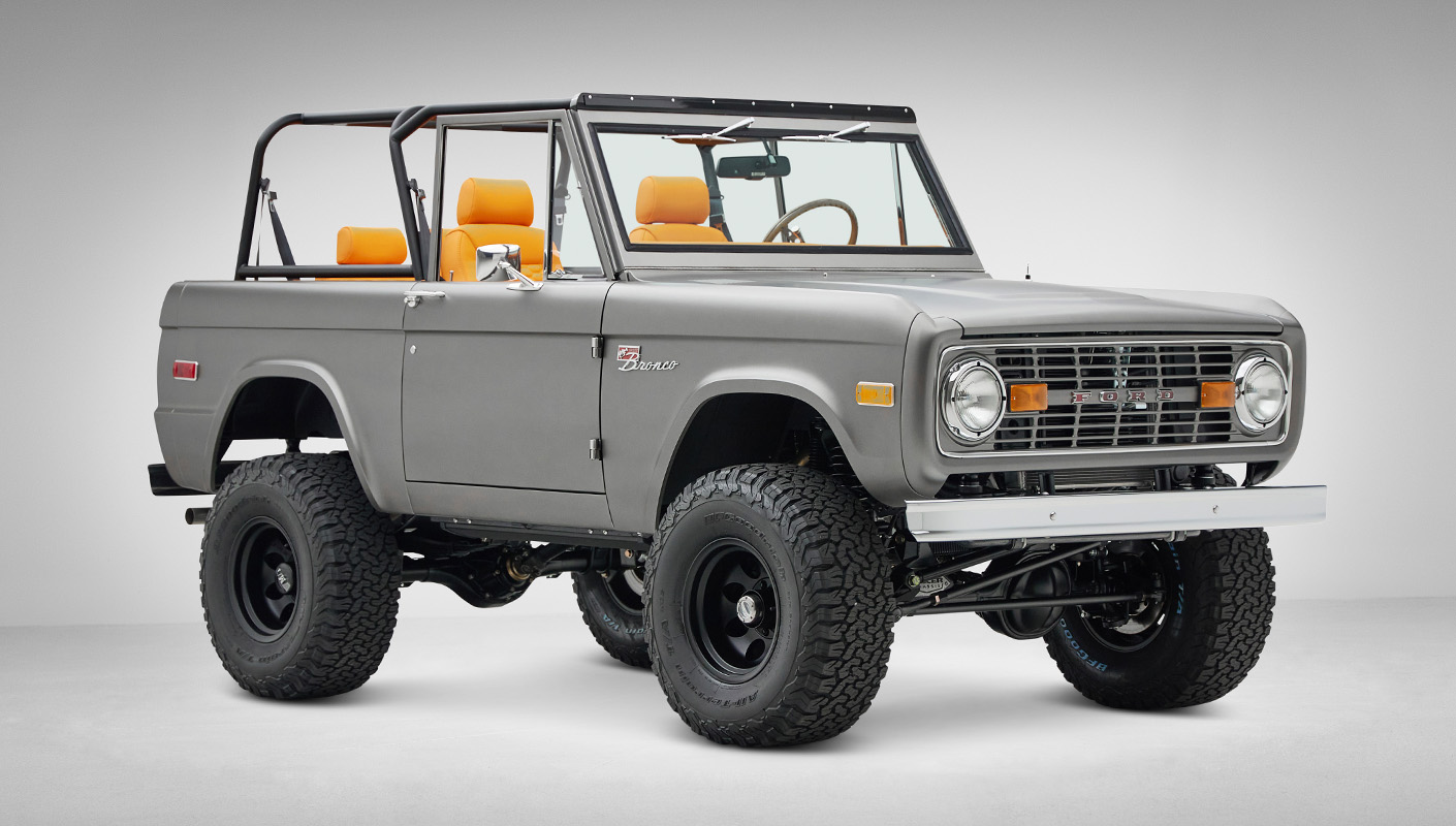 1972 Classic Ford Bronco in Matte Silver over Orange Leather interior front passenger 3/4
