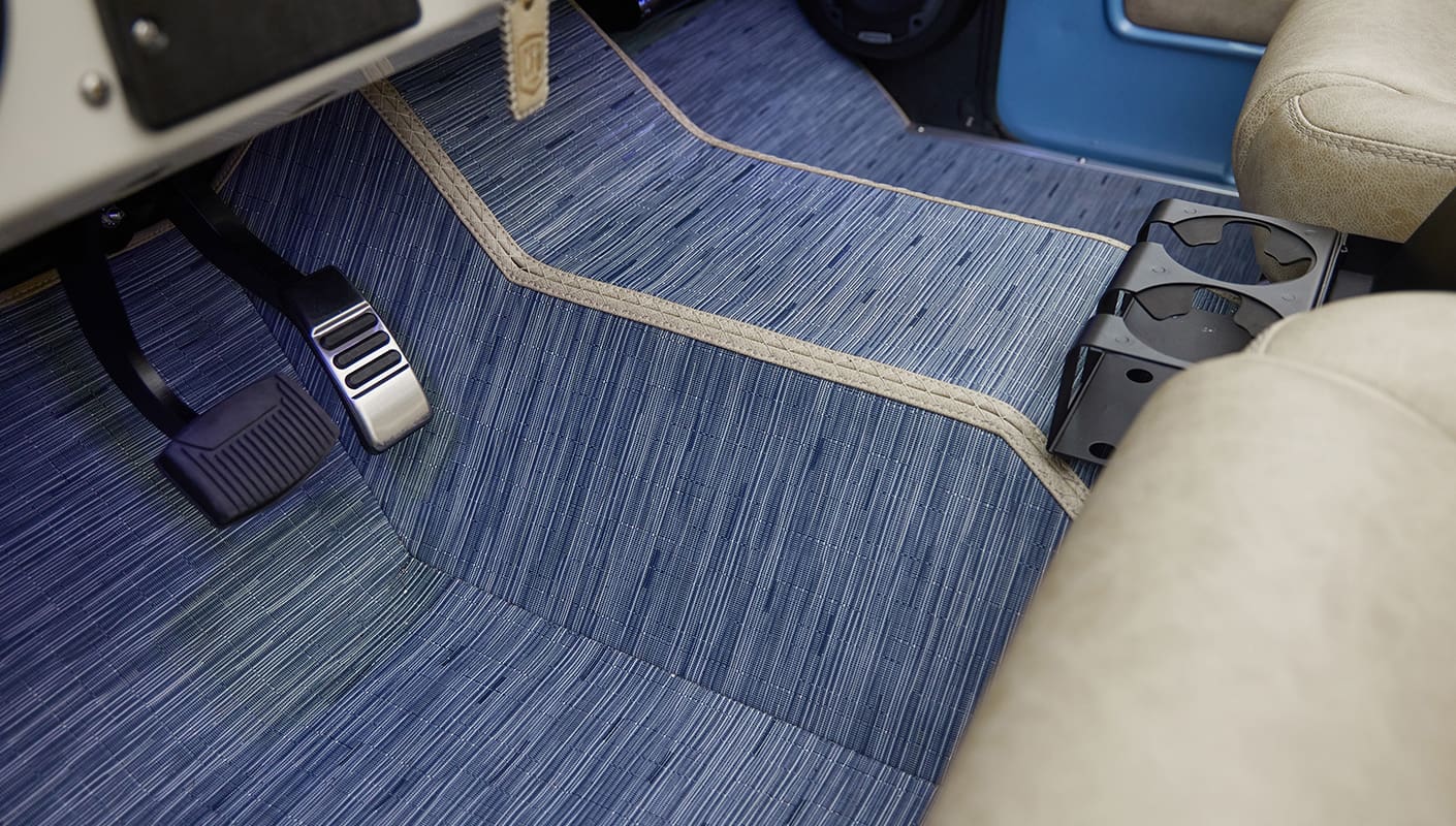 A 1976 Classic Ford Bronco is Frozen Blue over White Rock leather with custom carpet kit