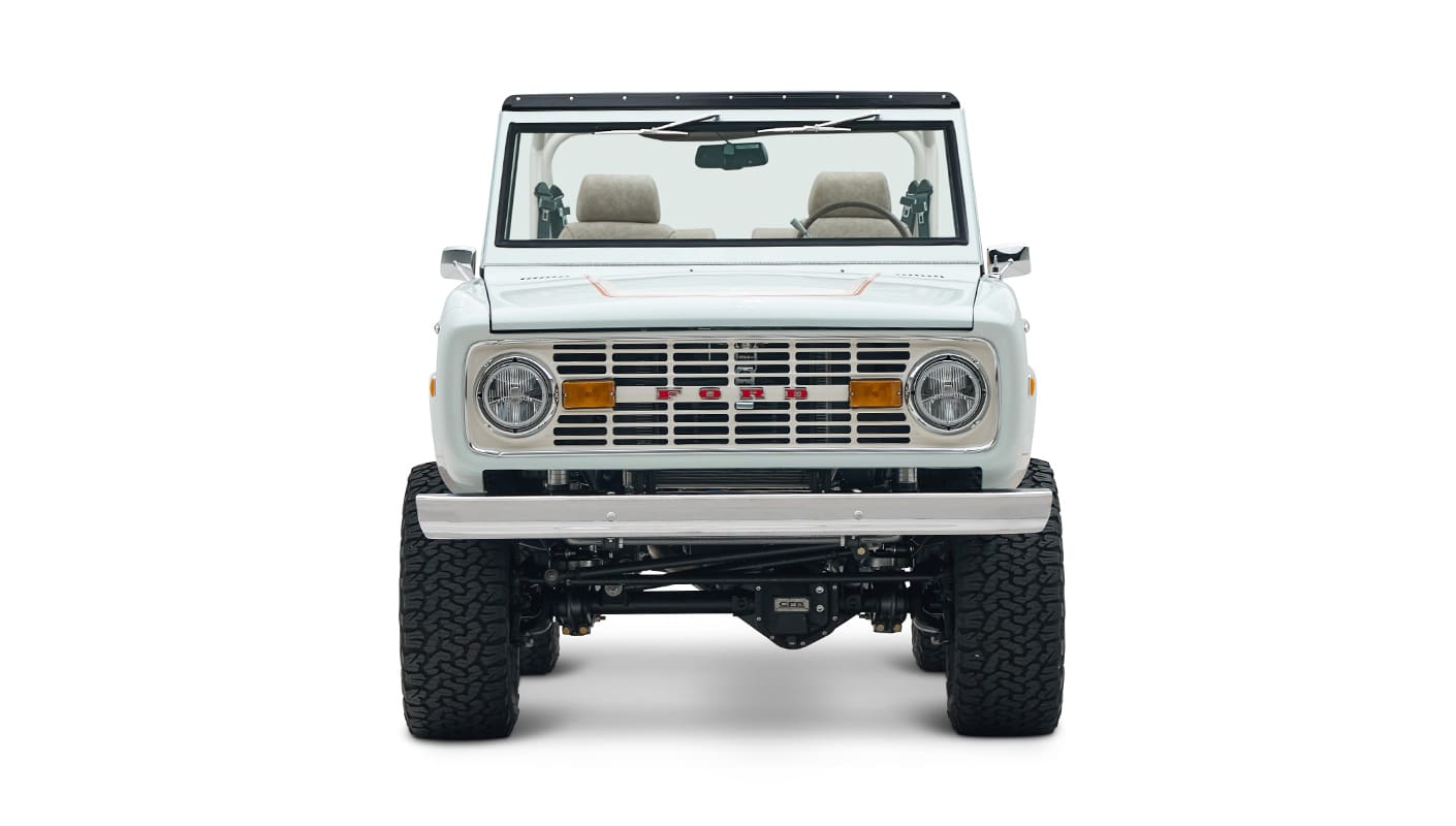 1973 classic ford bronco in diamond blue with butterscotch leather interior, vintage decals and chrome trim front profile