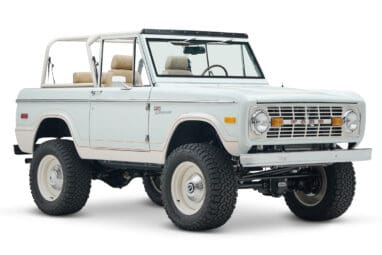 1973 classic ford bronco in diamond blue with butterscotch leather interior, vintage decals and chrome trim front passenger