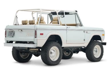 1973 classic ford bronco in diamond blue with butterscotch leather interior, vintage decals and chrome trim rear passenger