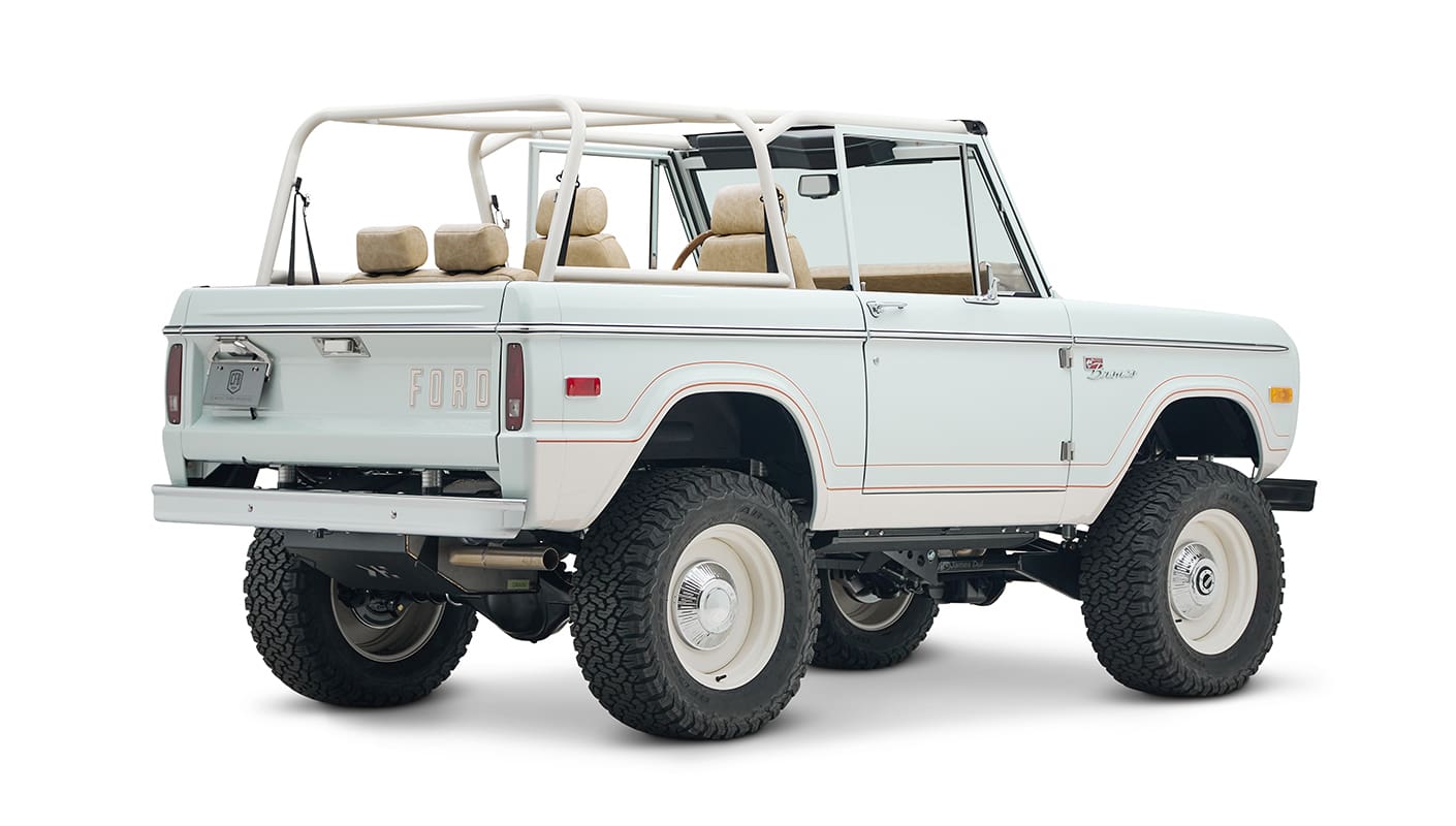 1973 classic ford bronco in diamond blue with butterscotch leather interior, vintage decals and chrome trim rear passenger