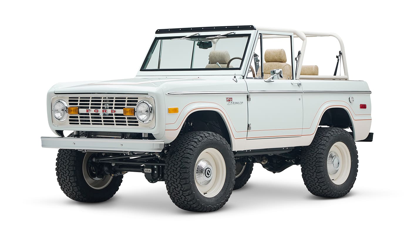 1973 classic ford bronco in diamond blue with butterscotch leather interior, vintage decals and chrome trim front driver