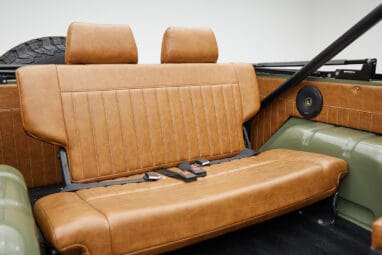 1976 classic ford bronco in boxwood green with ball glove leather rear angle