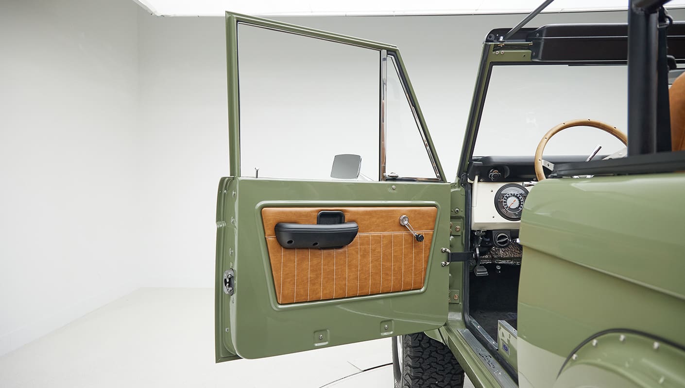 1976 classic ford bronco in boxwood green with ball glove leather door panel