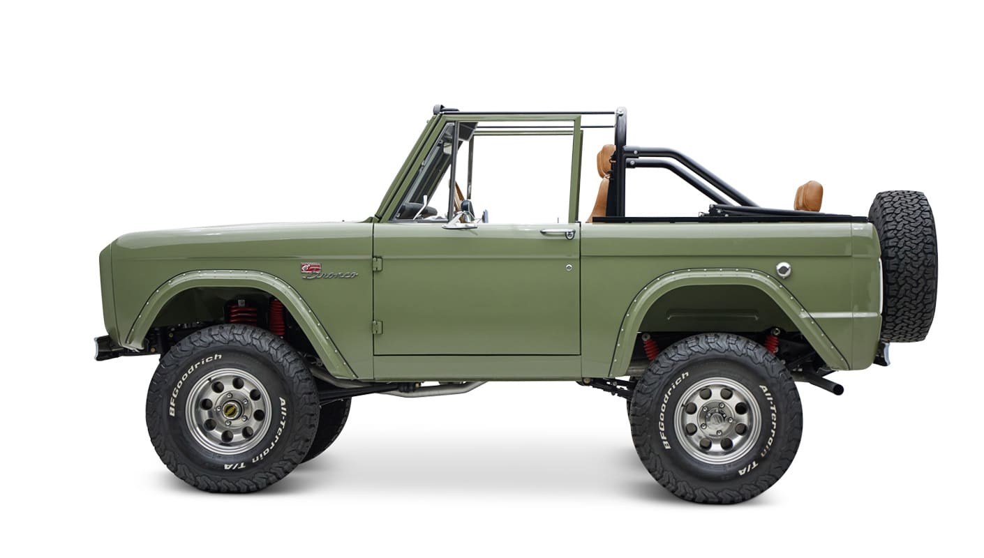 1976 classic ford bronco in boxwood green with ball glove leather driver profile