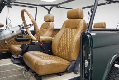 1966 ford bronco in highland green with whiskey leather interior driver seat