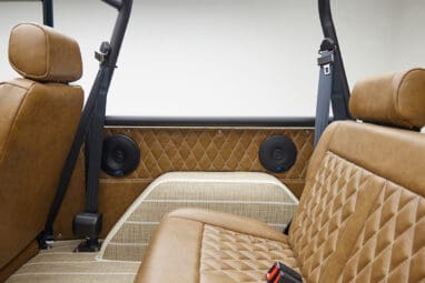 1966 ford bronco in highland green with whiskey leather interior rear seat panel