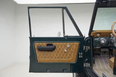 1966 ford bronco in highland green with whiskey leather interior door panel